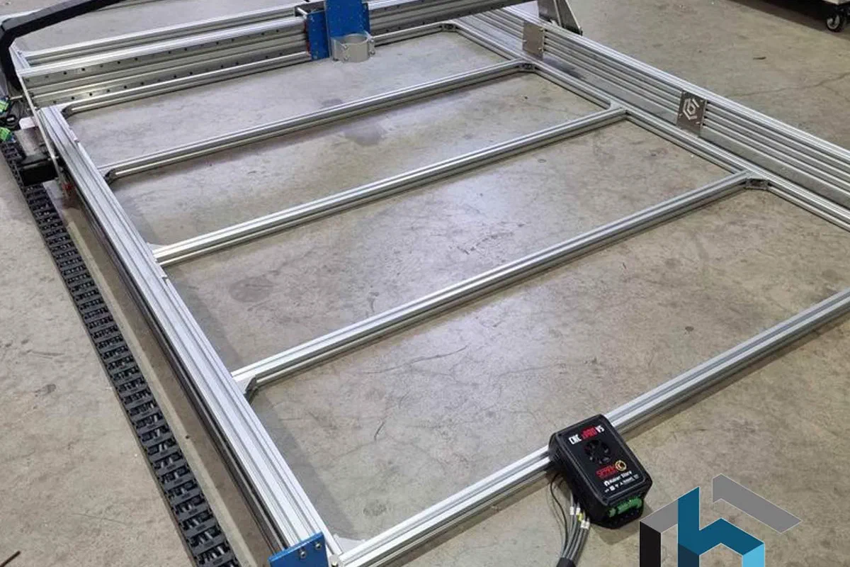 A BlueCarve Full Sheet Trax CNC router with an aluminium frame.