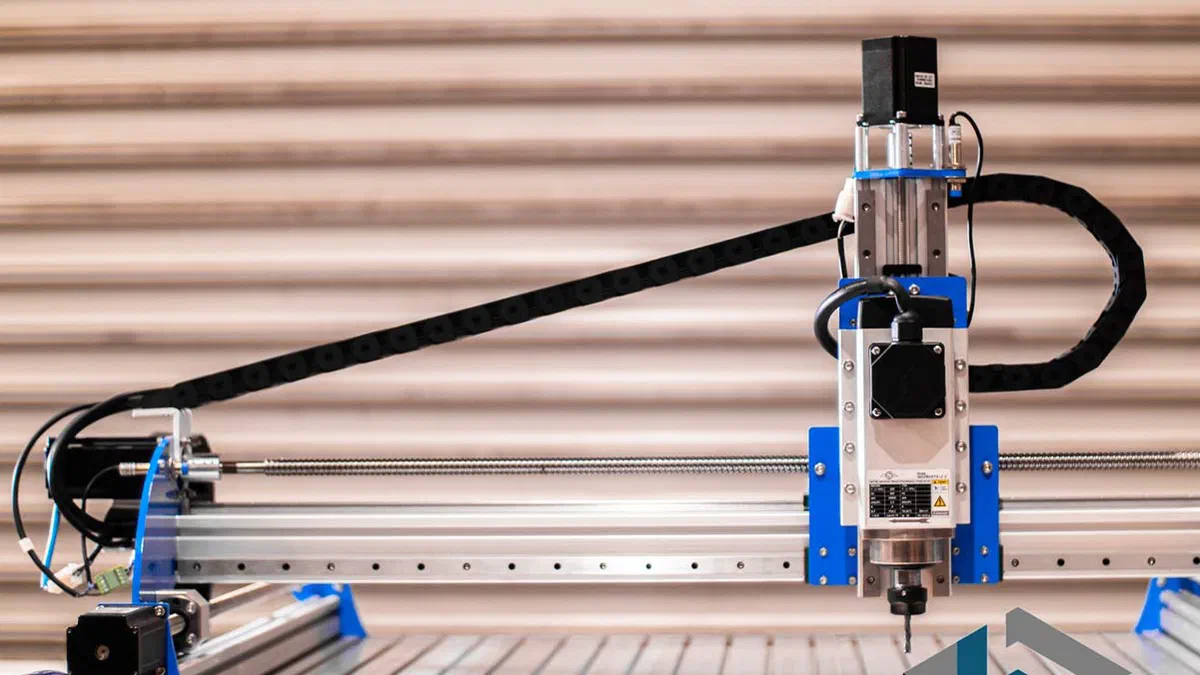 A CNC router carving a workpiece.