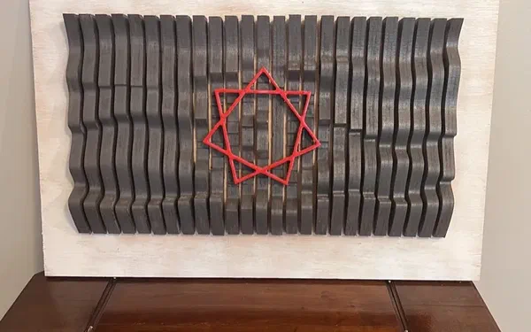 Carved wavy wall art made from slats